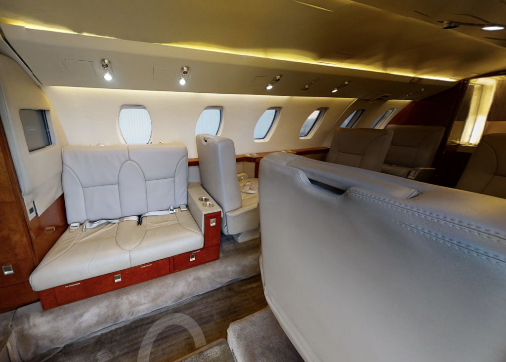 A small airplane with some seats and tables